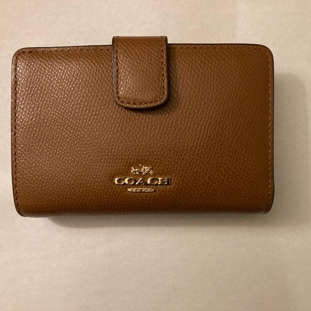 Like new Coach brown leather wallet with coin holder and slot for ID